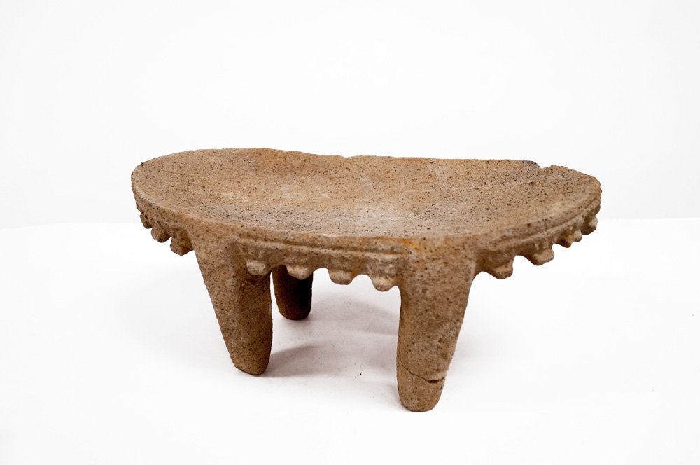 PRE-COLUMBIAN, NICOYA CULTURE, COSTA RICA VOLCANIC: PRE-COLUMBIAN, NICOYA CULTURE, COSTA RICA VOLCANIC STONE METATE, C.800-1200AD. HEIGHT 8 1/2"; LENGTH 18" (REPAIRED LEG)