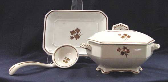 ANTHONY SHAW AND SONS/MEAKIN, TEA LEAF TUREEN: ANTHONY SHAW AND SONS/MEAKIN, TEA LEAF LUSTER SAUCE TUREEN/LADLE/UNDER PLATE, 19TH CENTURY. HEIGHT 5 1/2"; LENGTH 8 1/2" (STAINING, CRAZING)