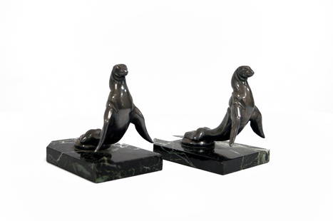 PAIR MAURICE FRECOURT (FRENCH 1890-), PAIR ART DECO: PAIR MAURICE FRECOURT (FRENCH 1890-), PAIR ART DECO SILVERED METAL/MARBLE SEAL BOOKENDS, SIGNED. HEIGHT 4 1/4"; LENGTH 5 1/8"