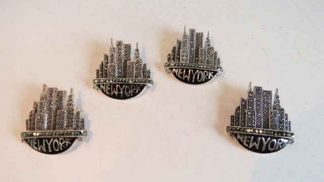 LOT (4) STERLING AND MARCASITE "NEW YORK" BROOCHES: LOT (4) STERLING AND MARCASITE "NEW YORK" BROOCHES