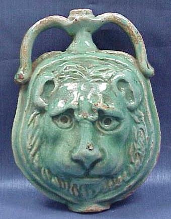 MEDITERRANEAN GREEN FAIENCE GLAZE LION MASK FLASK
