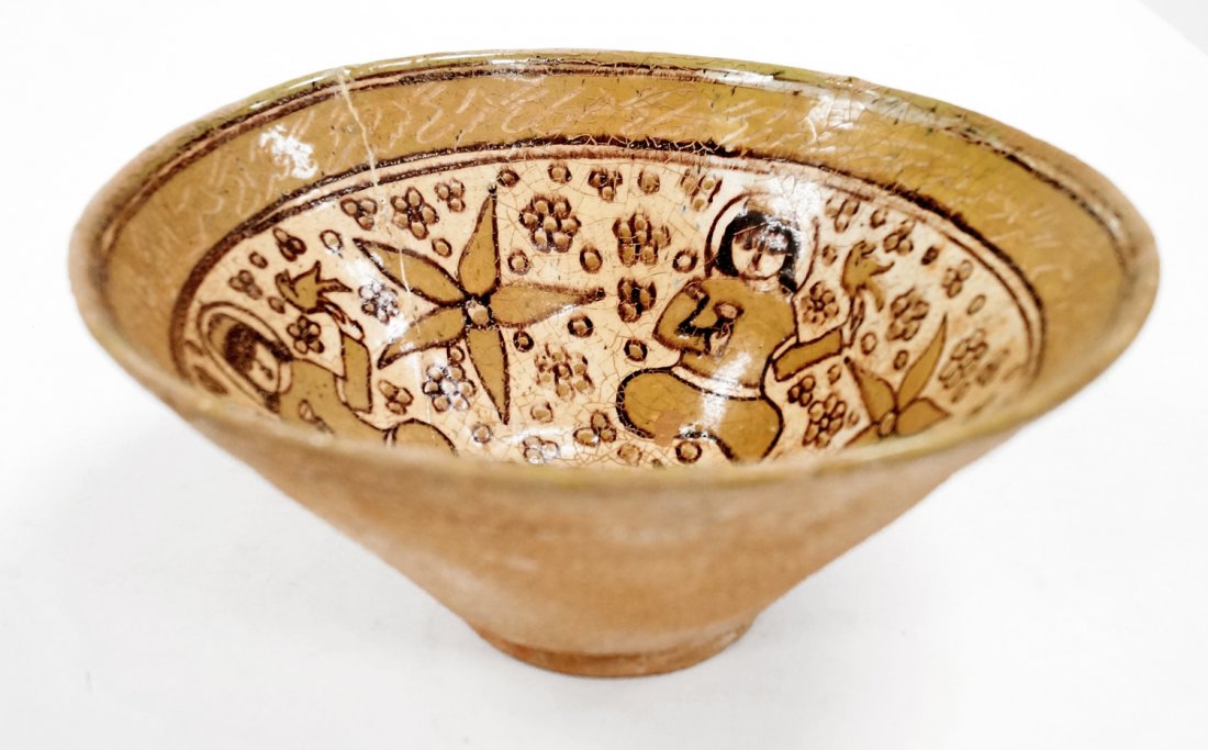 ISLAMIC DECORATED POTTERY BOWL WITH SEATED FIGURES. (1 of 4)