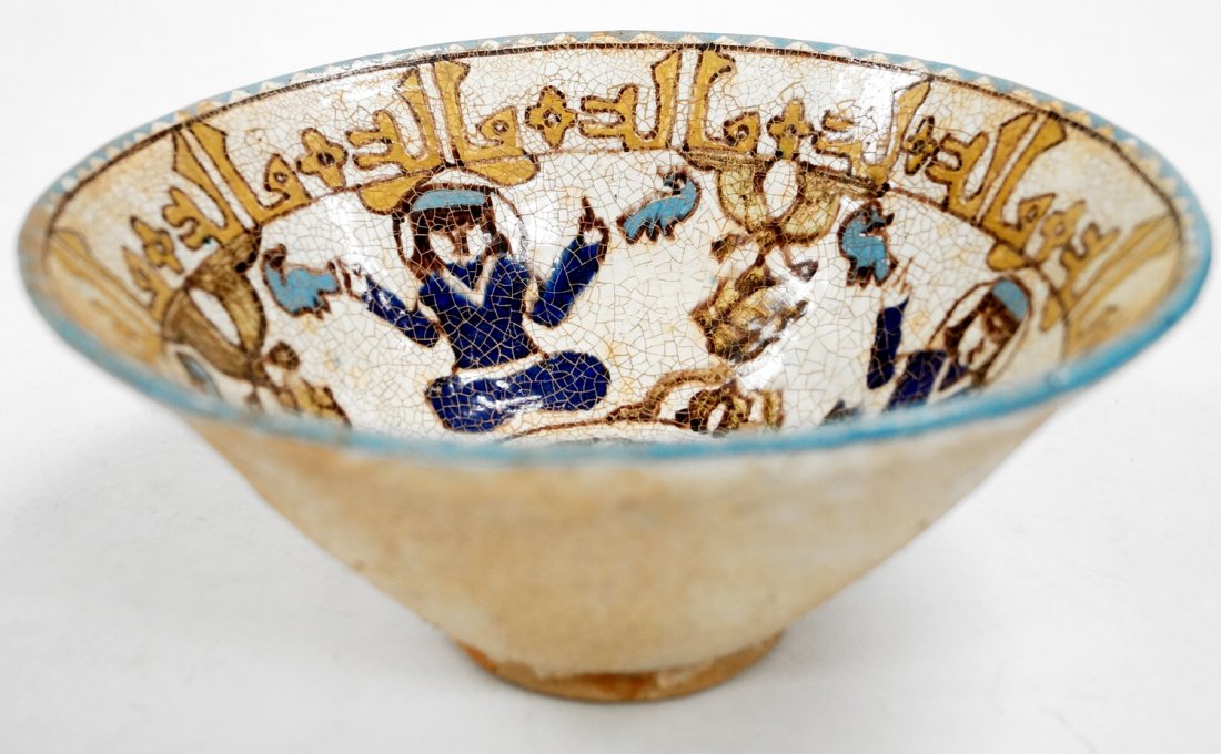 ISLAMIC DECORATED POTTERY BOWL WITH KUFIC SCRIPT. (1 of 3)