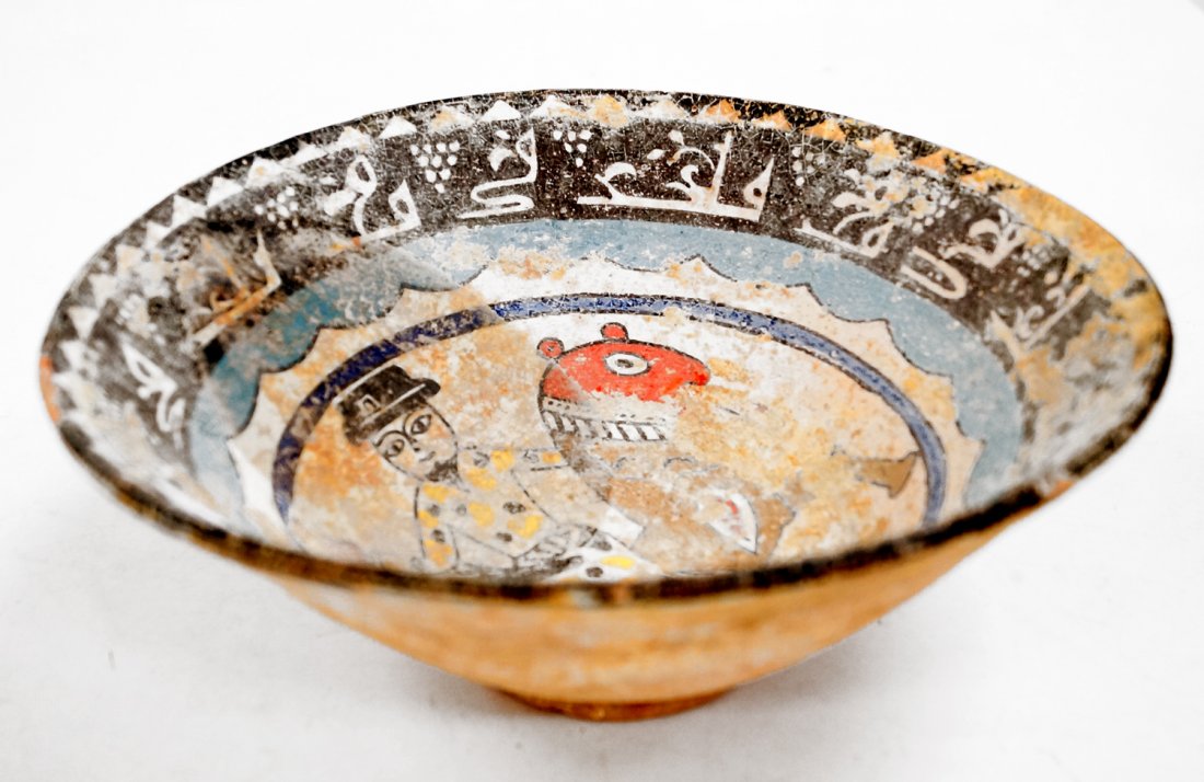 ISLAMIC DECORATED POTTERY BOWL WITH KUFIC SCRIPT.: ISLAMIC DECORATED POTTERY BOWL WITH KUFIC SCRIPT. HEIGHT 4"; DIAMETER 10"