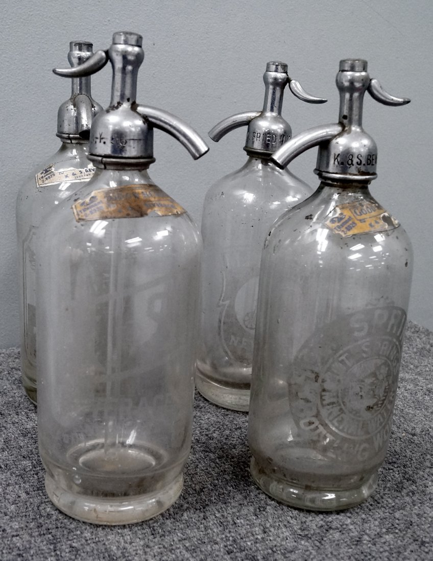 LOT (4) VINTAGE ETCHED SELTZER BOTTLES, C.1885. HEIGHT: LOT (4) VINTAGE ETCHED SELTZER BOTTLES, C.1885, INCLUDING EAGLE ROCK, M. FRIED, HYGIA AND HOT SPRINGS. HEIGHT 11 1/2"