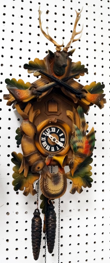 GERMAN BLACK FOREST CARVED CUCKOO CLOCK. HEIGHT 17": GERMAN BLACK FOREST CARVED CUCKOO CLOCK. HEIGHT 17"