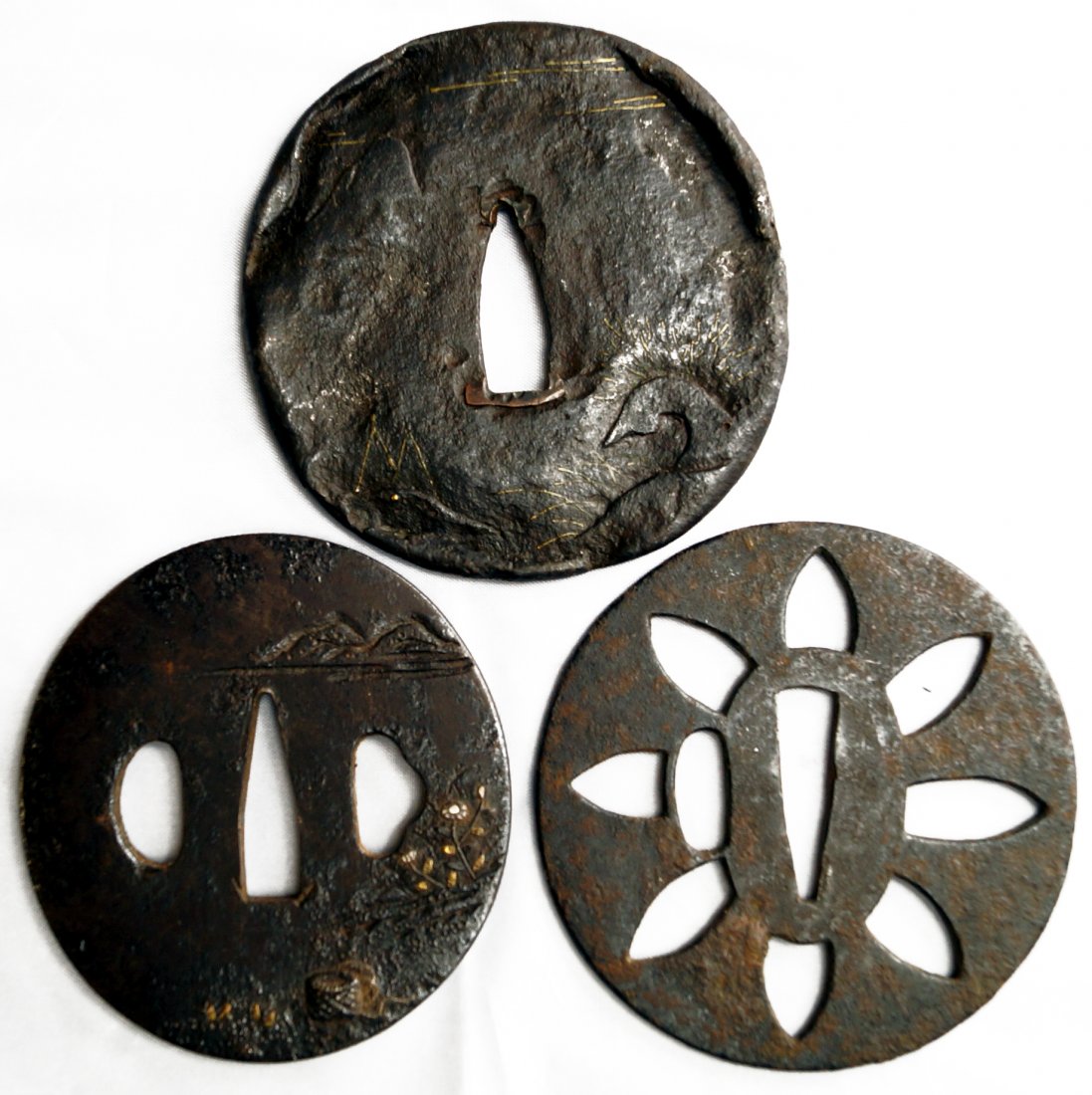 LOT (3) JAPANESE TETSU (IRON) TSUBAS; (1) SUKASHI, EDO,: LOT (3) JAPANESE TETSU (IRON) TSUBAS; (1) SUKASHI, EDO, DIAMETER 3"; (2) GOLD SUZI-ZOGAN, EDO. 2 7/8 X 2 5/8" AND 3 1/8 X 3"