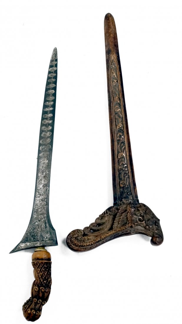 INDONESIAN DAMACUS DAGGER WITH CARVED HANDLE AND: INDONESIAN DAMACUS DAGGER WITH CARVED HANDLE AND SCABBARD, 19TH CENTURY. LENGTH 21"