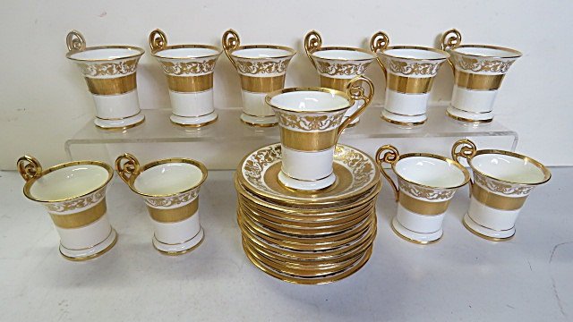 SET (11) MINTON GILT DECORATED EMPIRE STYLE PORCELAIN: SET (11) MINTON GILT DECORATED EMPIRE STYLE PORCELAIN COFFEE CUPS/SAUCERS. RETAILED BY HIGGINS & SEITER.