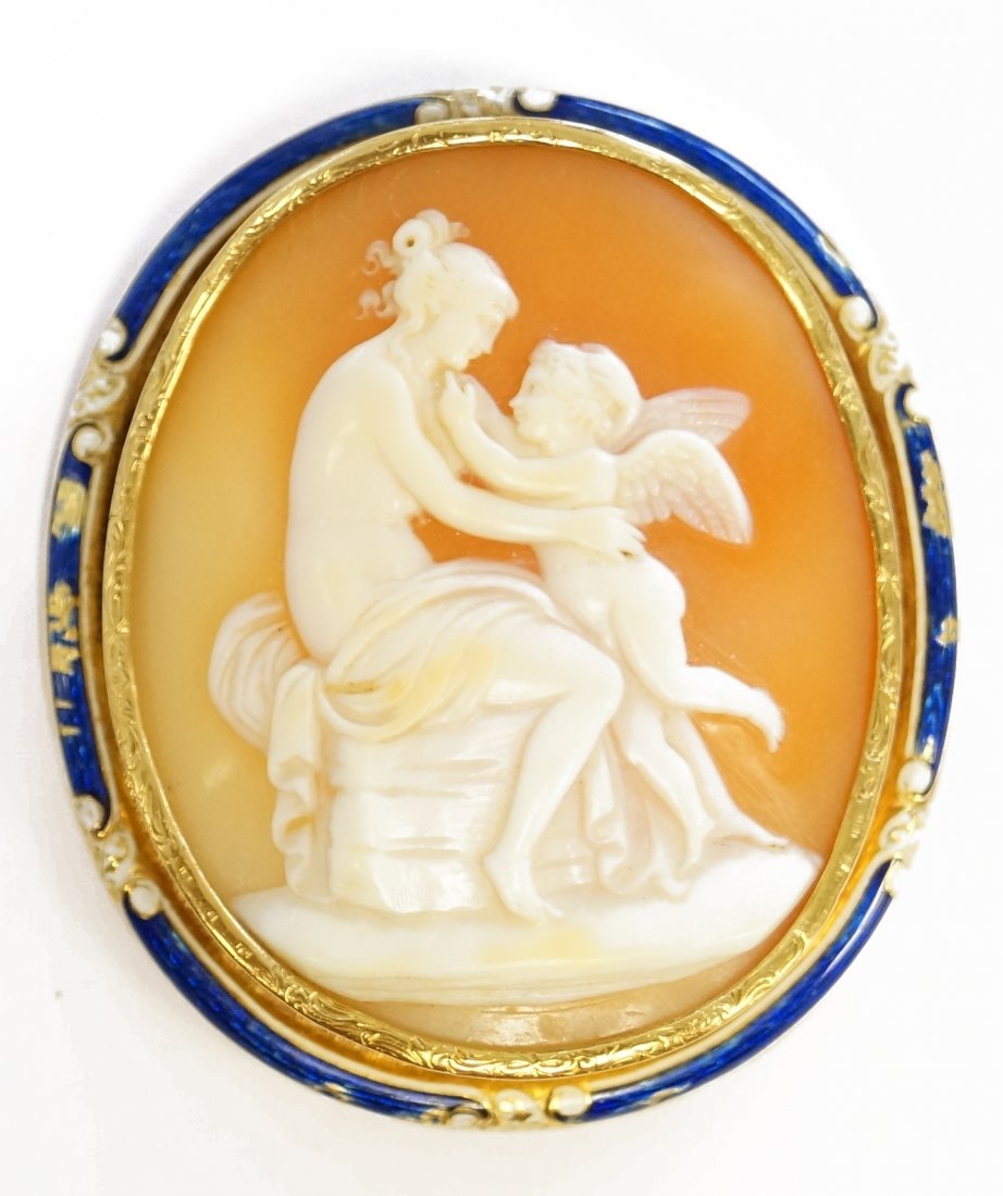 VICTORIAN YELLOW GOLD (TESTS 14K) ENAMEL FRAMED CARVED: VICTORIAN YELLOW GOLD (TESTS 14K) ENAMEL FRAMED CARVED SHELL CAMEO, NUDE WOMAN WITH CHERUB, PENDANT/BROOCH. 2 X 1 3/4"; GROSS WEIGHT 17.8 GRAMS (RE-SOLDERED PENDANT, RING AND HINGE CLASP)