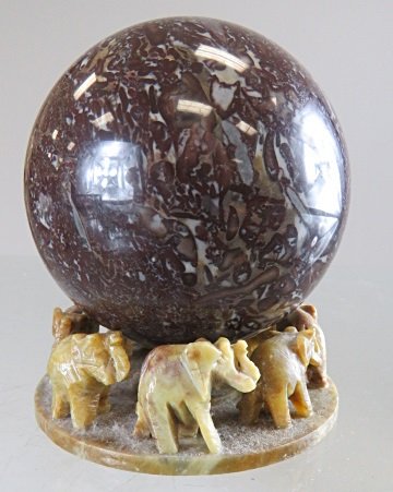MARBLE ORB ON CARVED SOAPSTONE ELEPHANT BASE. HEIGHT 5": MARBLE ORB ON CARVED SOAPSTONE ELEPHANT BASE. HEIGHT 5"