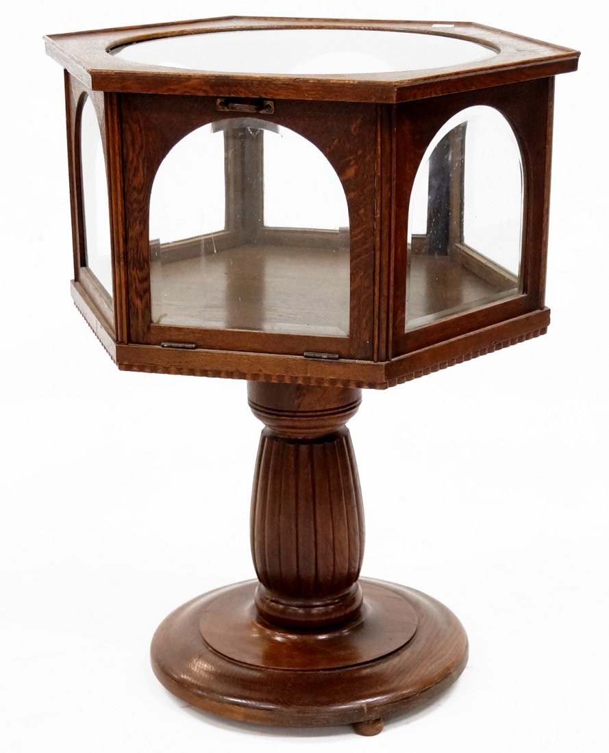 CARVED OAK REVOLVING HEXAGONAL DISPLAY CASE. HEIGHT 31"; (1 of 2)