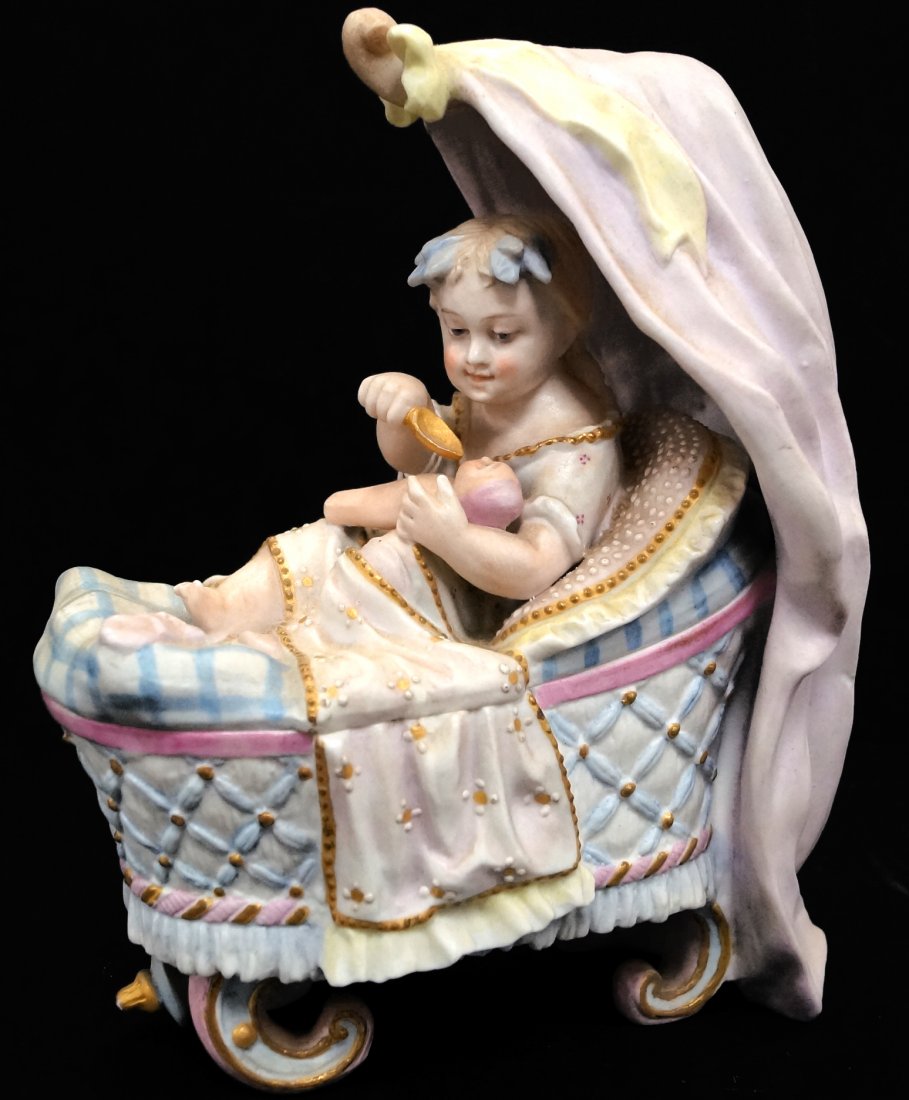 VICTORIAN BISQUE DECORATED FOX BABY IN CRADLE FEEDING A: VICTORIAN BISQUE DECORATED FOX BABY IN CRADLE FEEDING A DOLL. HEIGHT 8 1/2"; LENGTH 6 1/2" (SPOON HANDLE MISSING)