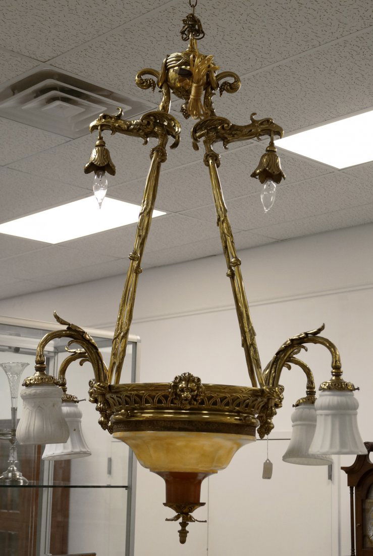 FRENCH STYLE BRASS CHANDELIER WITH GRIFFIN HEADS. (1 of 3)