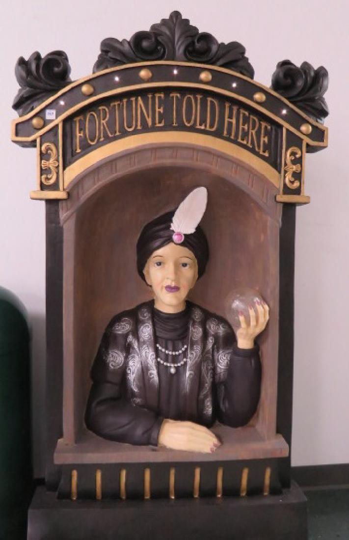LARGE "FORTUNE TELLER" PROP PAINTED RESIN WITH BATTERY: LARGE "FORTUNE TELLER" PROP PAINTED RESIN WITH BATTERY OPERATED LIGHTS ON CREST. HEIGHT 61"; WIDTH 35"; DEPTH 16"
