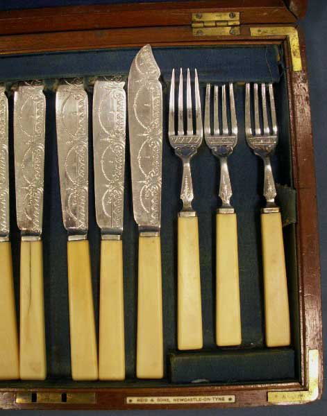 SHEFFIELD SILVER PLATE CASED FISH SET: SHEFFIELD SILVER PLATE CASED FISH SET WITH IVORY HANDLES, (12) FORKS, (12) KNIVES; CASED MARKED: NEWCASTLE-ON-TYNE, (AGE CRACKS ON HANDLE) **CANNOT EXPORT IVORY**