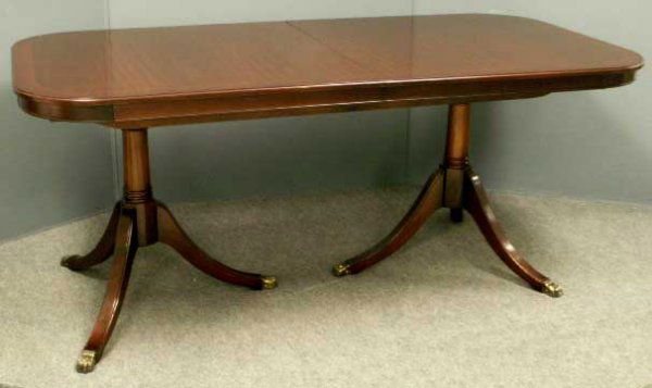 REGENCY STYLE MAHOGANY DINING TABLE: REGENCY STYLE MAHOGANY DOUBLE-PEDESTAL DINING TABLE WITH 19 1/2" LEAF. HEIGHT 30", TOP 38 X 72" **DUE TO THE SIZE AND OR FRAGILITY OF THIS LOT, STANDARD IN-HOUSE SHIPPING IS NOT AVAILABLE. CONTACT THE