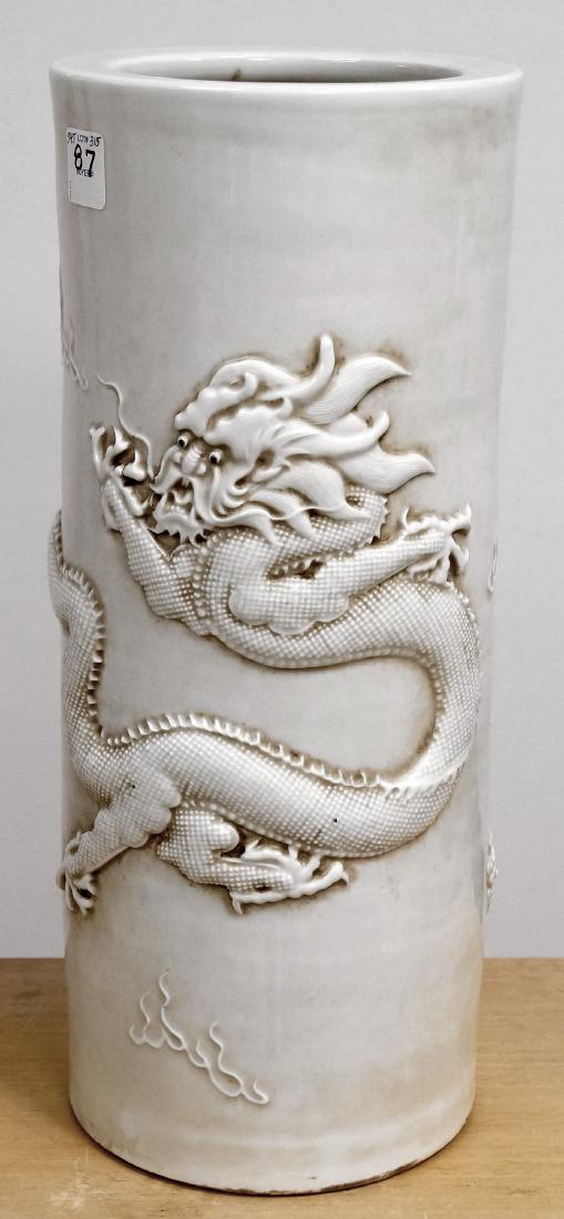 CHINESE BLANC DE CHINE PORCELAIN CYLINDER VASE WITH: CHINESE BLANC DE CHINE PORCELAIN CYLINDER VASE WITH DRAGON MOTIF, BEARING SPURIOUS YUNG CHENG SEAL FORM MARK. HEIGHT 15 3/4"