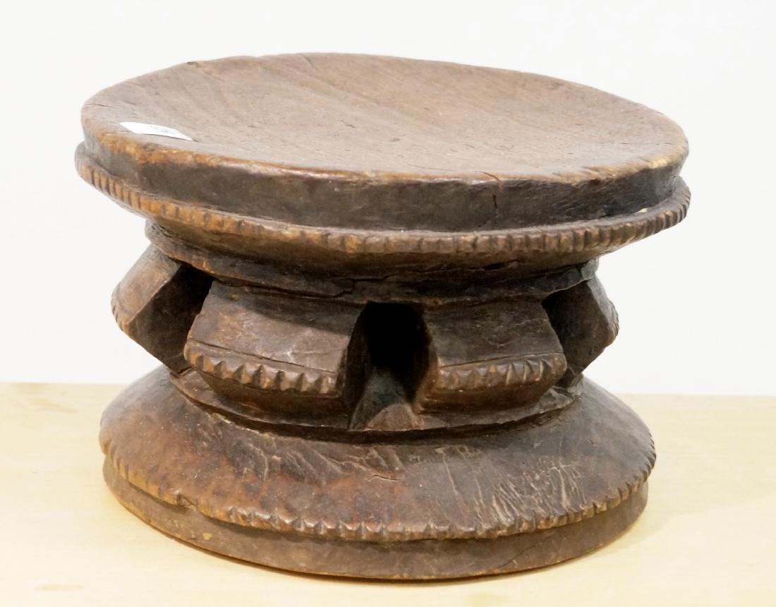 AFRICAN CARVED STOOL. HEIGHT 6 3/4"; DIAMETER 10 3/4" (1 of 2)