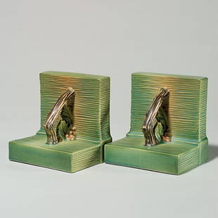 Roseville Bushberry bookends, pair, green,5 1/4",: Pair of Bushberry bookends in green, shape 9 with raised marks. Height 5 1/4 inches. Two small chips are beneath the base of one bookend. Good mold and color on both.