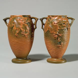 2 Rv Bushberry vases, 35-9", russet, 9 3/8", nicks,: Two Bushberry vases in russet, shape 35-9" with raised marks. Heights 9 3/8 inches. One vase has irregular areas on the berries. Other vase has a pin nick with line on the rim and nick on the base.