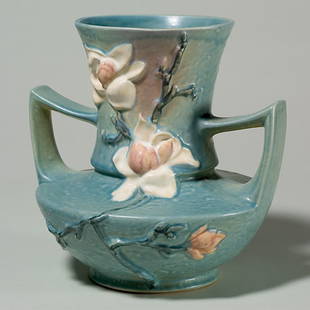 Roseville Magnolia vase, shape 93-9, blue: Magnolia vase in blue, shape 93-9" with raised marks. Height 9 1/8 inches. Chips beneath the base. Soft mold, good color.