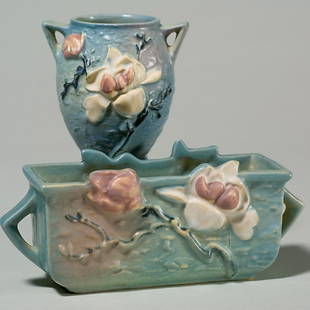 2 Rv blue Magnolia: window box, 388-6"; vase, 86-4": Two Magnolia in blue with raised marks: Window box, shape 388-6". Height 3 3/4 inches. Good color and mold. Vase, shape 86-4". Height 4 1/8 inches. Protrusion on petal. Crisp mold.