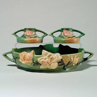 Roseville Magnolia console set:bowl, candlesticks: Magnolia console set in green with raised marks: Pair of candlesticks, shape 1156-2". Heights are 2 1/4 inches. Good mold and color. Console bowl, shape 450-10". Height 3 1/4 inches. Interior stains,