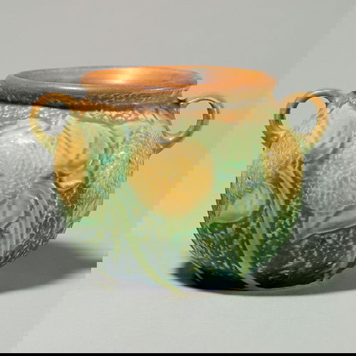 Roseville Sunflower vase, shape 566-4".: Roseville Sunflower 4 inch vase, shape 566-4". Marked with small black sticker.