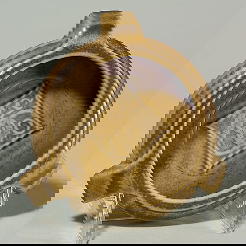 Rookwood brown mat ashtray, 1922, shape 1383: Mat glazed ashtray, made in 1922 and covered with a tan and brown glaze. The 1 1/8 inch by 5 1/2 inch receiver was probably made for a commercial client, as "B & Co" is molded into the bowl. Marked wi