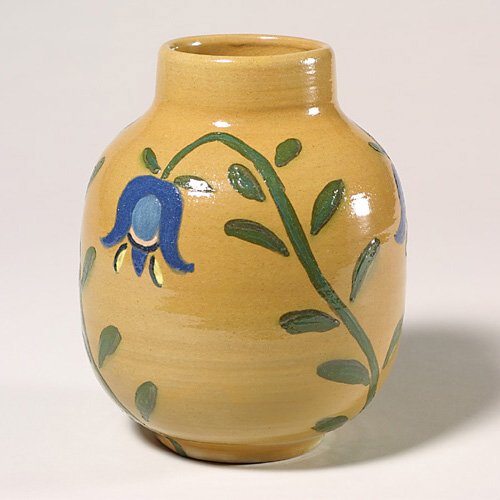 UND decorated floral vase, Helen Nelson: UND vase with hand painted pasque flowers on a buff body done by Helen Nelson, circa 1950 to 1954 and covered in a glossy finish. There are three sets of flowers and leaves. Marked with the UND logo a