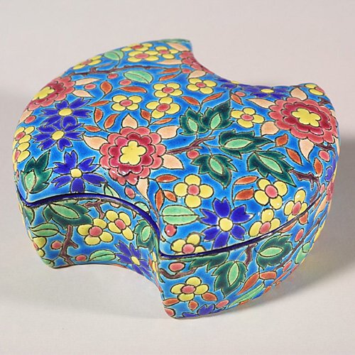 Longwy covered box, bow tie shape, 2 1/: Unusual bow tie shaped covered Longwy box with overall floral patterns. Marked with a vertical "Emaux de Longwy France" transfer logo and the notation "Forme: 1504 Decor: 5669". Height is 2 1/8 inches
