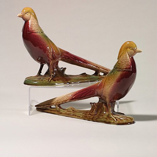 Two Rookwood pheasants, 1949, 2832, 8: Handsome pair of glossy polychrome pheasants made in 1949 display colorful plumage in crimson, yellow and brown. Marks include the Rookwood logo, date, and shape number 3832. Height 8 7/8 inches and l