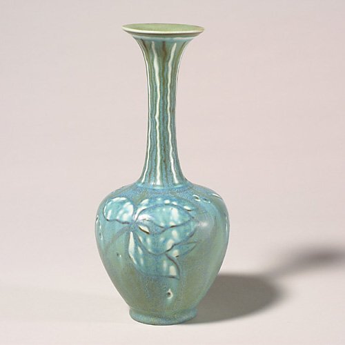 Rookwood mat vase, Barrett, slip floral: Mate to Lot 1542, this vase incorporates a similar slip decorated floral design, also done by Elizabeth Barrett in 1944. Marks are the same, including the Rookwood logo, date, shape number 778 and the