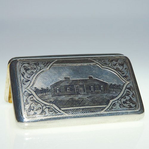 Russian silver cigarette case, niello bldg,4X2 1/2: Silver and niello Russian cigarette case. An Arts & Crafts style dwelling graces the front surrounded by scrolling vines against a stippled backdrop. The back repeats the front design replacing the bu