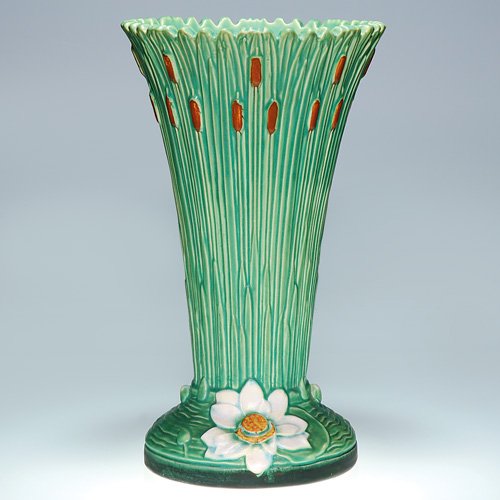 Tall Weller Ardsley umbrella stand, 19 1/2: Weller Ardsley 19 1/2 inch umbrella stand decorated with cattails and white waterlilies. Marked with the Weller half-kiln stamp. There is crazing and some minor firing separations.