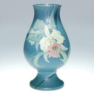 Weller Hudson vase, orchids, Timberlake, 8 3/4: Weller Hudson vase with splashy decoration of a white and pink orchid on the front and a ghost orchid in blues on the back, the work of Mae Timberlake. Impressed with the Weller Pottery 'incised" mark