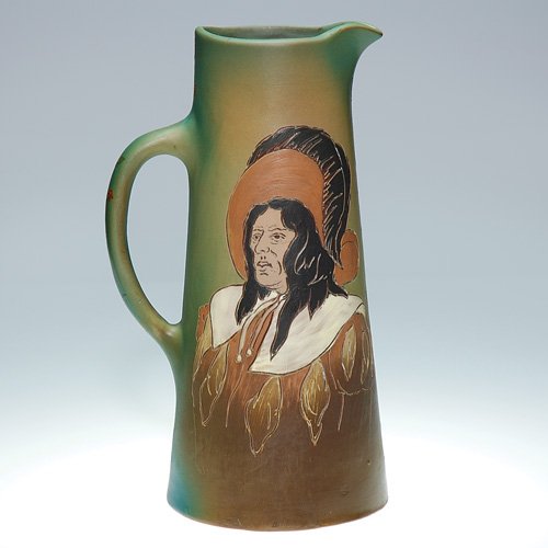 Weller Dickens Ware II tankard, Conquistador: Weller Second Line Dickensware 12 inch tankard decorated with a portrait of a Conquistador by John Herold. Impressed with the Dickensware Weller logo and 380 1 on the base and bearing the artist's mon