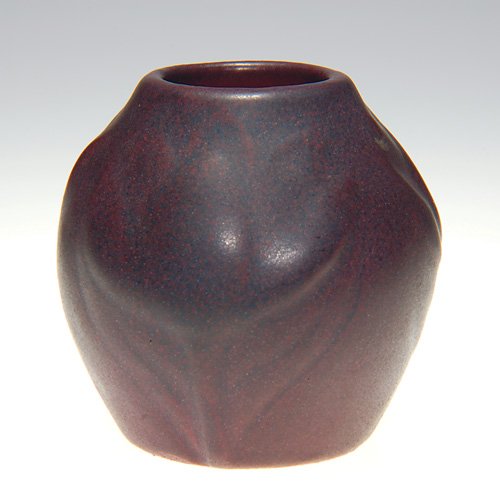 Van Briggle 2 1/2" vase, dated 1918, maroon: Petite Van Briggle Mulberry vase made in 1918 and covered with the dark mat maroon glaze. Marked with the incised Van Briggle logo and the date. There is fine overall crazing. Height is 2 1/2 inches.