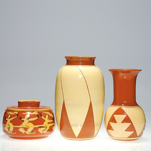 3 Pine Ridge pieces, Cottier, Doyle, Woody: Pine Ridge Pottery lot of 3 items: a 3 3/4 inch covered bowl encircled by Native American 'Ghost Dancers," in yellow on a terra cotta ground. Unmarked. Oral tradition indicates that Bruce Doyle was di