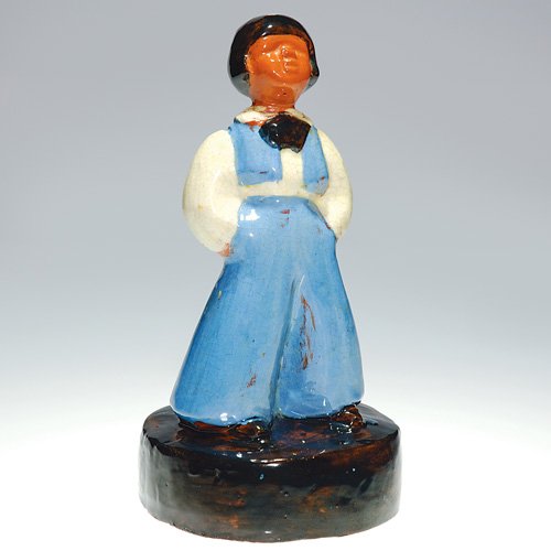 Brown County Pottery boy figural, 9: Brown County Pottery figural of a dapper young lad wearing blue britches and matching vest. Height 9 inches. Inscribed 'Brown County Pottery" inside circular base. His head has been broken off and glu