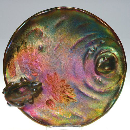 Jerome Massier 5 3/4" iridescent tray w/frogs: Tray featuring a frog seated on one edge facing another frog, partially submerged, crafted by Jerome Massier and covered with the metallic luster glaze for which the Massier family is so well known. I