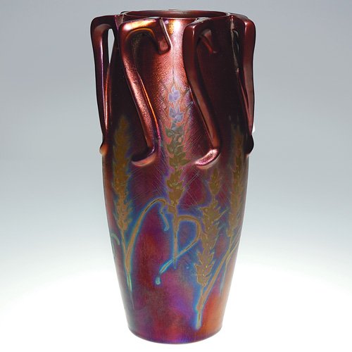 Clement Massier 7 handled vase, iridescent, 12 3/8: Iridescent metallic luster 12 3/8 inch vase with seven handles, decorated with wheat designs by Clement Massier and covered with the rich glaze that he made famous. Signed M. Clement Massier, Golfe Ju