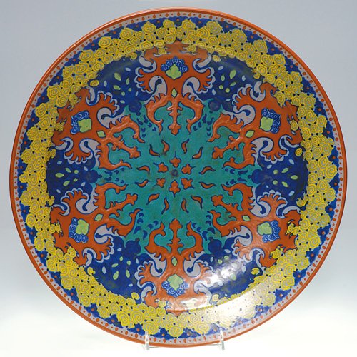 Gouda (PZH) charger, Westland, floral, 16 1/8: Large PZH 'Westland" mat glaze charger with rich, complex floral designs done in 1918. Marked 'Westland 1165/40 Holland Gouda" in blue slip on the back. Also marked with the date symbol for 1918, the 