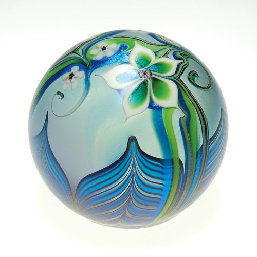 Orient & Flume paperweight, millefiori, 2 3/4: Early Orient & Flume paperweight with white millefiori blossoms surrounded by pulled designs in blue. Height 2 3/4 inches. Engraved 'Orient & Flume 66D 1979" beneath. Very good condition.