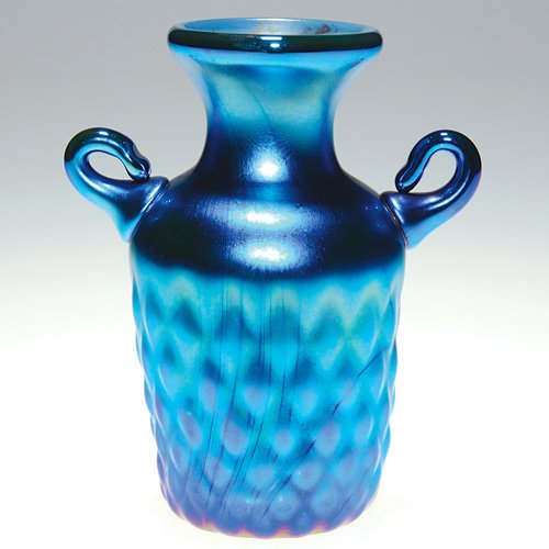 Orient & Flume blue DQ vase, 3 1/2", 1975: Early miniature Orient & Flume blue aurene vase wrapped with diamond quilted pattern and having applied handles. Height 3 1/2 inches. Etched in the pontil 'Orient & Flume 1975." Very attractive and in