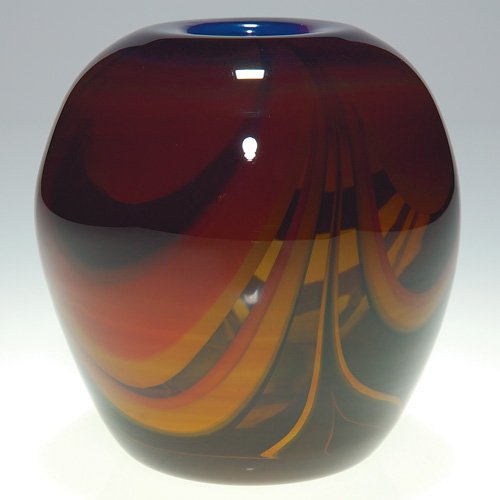 Cased Labino vase, colorful swags, 5", 1970: Nice cased vase fashioned by Dominick Labino in 1970. The vessel encircled with large swags in yellow, orange and cobalt blue and preserved under a layer of amber glass. Height 5 inches. Inscribed by