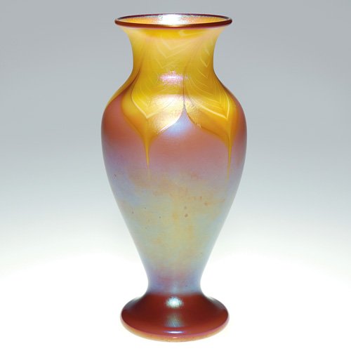 Orient & Flume vase, gold pulled feather, 8: Early Orient & Flume vase having citron and white feathers pulled from the rim onto a shapely iridescent plum body. Height 8 inches. Company name, AT 161 and the 1977 date is engraved below the base.