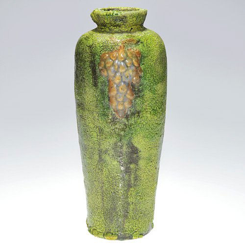 Wheatley green and red vase, grapes, 10 1/4": Unusual Wheatley vase with embossed grapes done in thick, gloopy red, green and occasional yellow mat glazes. Over the years, we have seen some amazing Wheatley tiles with this same glaze and wondered