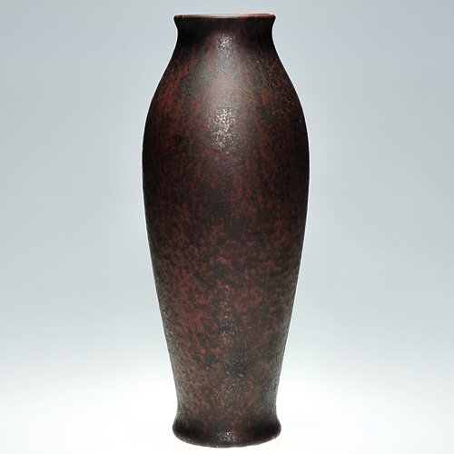 Tall Roseville Pauleo vase, rust color, 16 1/8": Roseville Pauleo vase covered with a rich gunmetal black over red glaze. The only mark on the vessel is the number 119 incised on the base. A great Arts & Crafts combination of form and glaze and stan